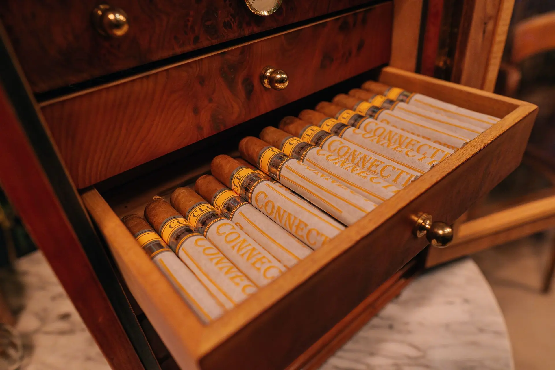 Premium cigar box displayed in one of Grand Milan Lambrate's exclusive lounge areas, a perfect luxury event venue.